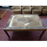 A cow hide topped coffee table