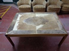 A cow hide topped coffee table