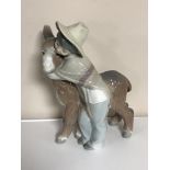 A Lladro figure of a child and donkey
