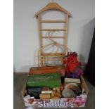 A suit valet stand together with a box of cases, wallets,