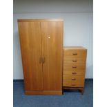 A mid twentieth century teak G-plan double door wardrobe together with six drawer chest