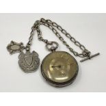 A heavy large silver pocket watch with silver dial on silver Albert chain CONDITION