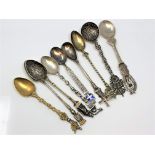 Nine highly ornate silver gilt and enamel spoons, including Napoleon.