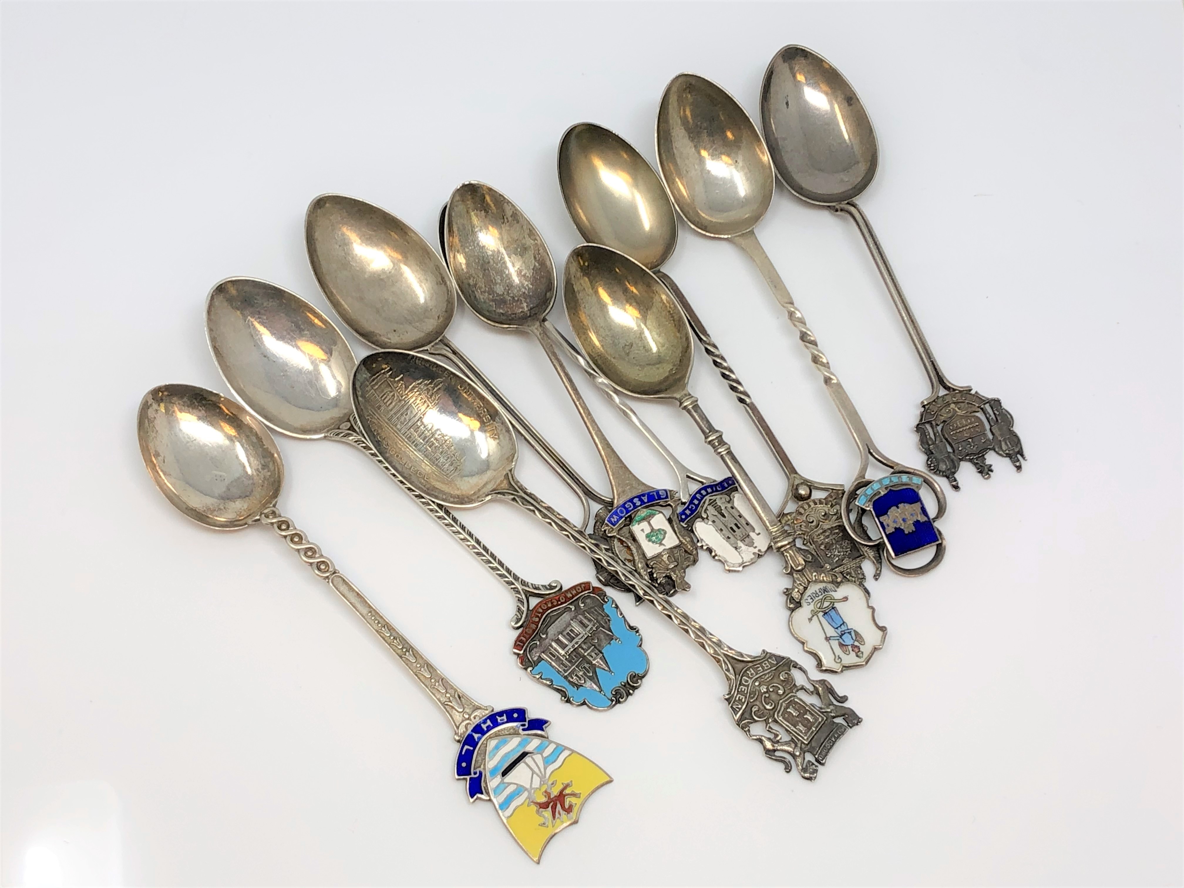 A collection of silver and enamel Scottish, Welsh spoons, Glasgow, Forfar, Dumfries, Edinburgh,