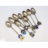 A collection of silver and enamel Scottish, Welsh spoons, Glasgow, Forfar, Dumfries, Edinburgh,