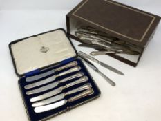 A large quantity of silver handled knives, boxed set etc.