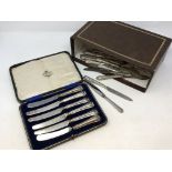 A large quantity of silver handled knives, boxed set etc.