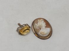 An antique gold cameo and a citrine fob (2)