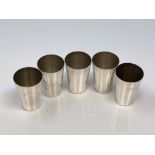 A set of silver miniature tumblers