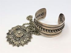 A collection of continental white metal jewellery comprising of bangle and pendant on chain.