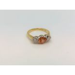 An 18ct yellow gold citrine and diamond ring, size J.