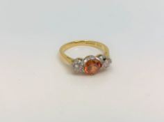 An 18ct yellow gold citrine and diamond ring, size J.