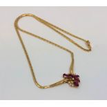 An 18ct gold ruby and diamond necklace, 12.45g. CONDITION REPORT: Chain length 42 cm.