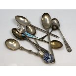 A collection of silver spoons including David Andersen enamel, early Irish example etc.