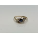 An antique 18ct gold sapphire and diamond ring, 2g.