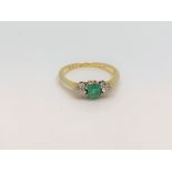 An antique 18ct yellow gold emerald and diamond ring, size J.