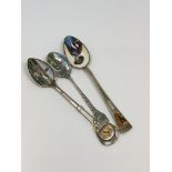 Three good quality enamelled silver spoons