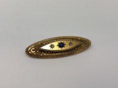 An antique 15ct gold sapphire and diamond brooch