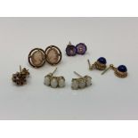 Four pairs of gold earrings set with cameo, opals,