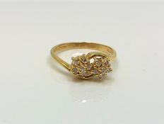 An 18ct gold double diamond cluster ring, 2.77g.