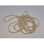 An approximately 95 inch strand of pearls