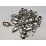 A large quantity of Newcastle silver spoons and sugar nips etc. Gross weight 543g.
