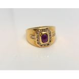 An 18ct yellow gold cabochon ruby and diamond set ring, size O.
