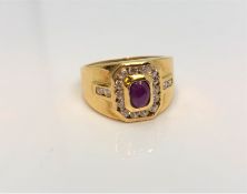 An 18ct yellow gold cabochon ruby and diamond set ring, size O.