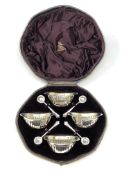 A boxed set of four Victorian silver gilt salts and spoons,