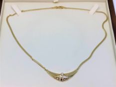 An 18ct gold diamond set necklace,