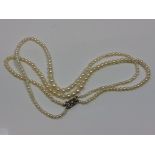 A good double strand of pearls on gold and diamond clasp CONDITION REPORT: Pearks