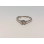An 18ct white gold diamond solitaire ring, approximately 0.