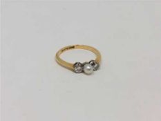 An 18ct gold pearl and diamond ring, size P. CONDITION REPORT: 2.4g.