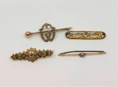 Four antique yellow gold brooches.