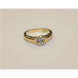 An 18ct gold diamond ring in heart shaped setting, approximately 0.3ct, Size I.
