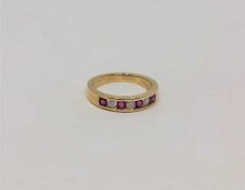 An 18ct gold ruby and diamond ring, size J CONDITION REPORT: 2.