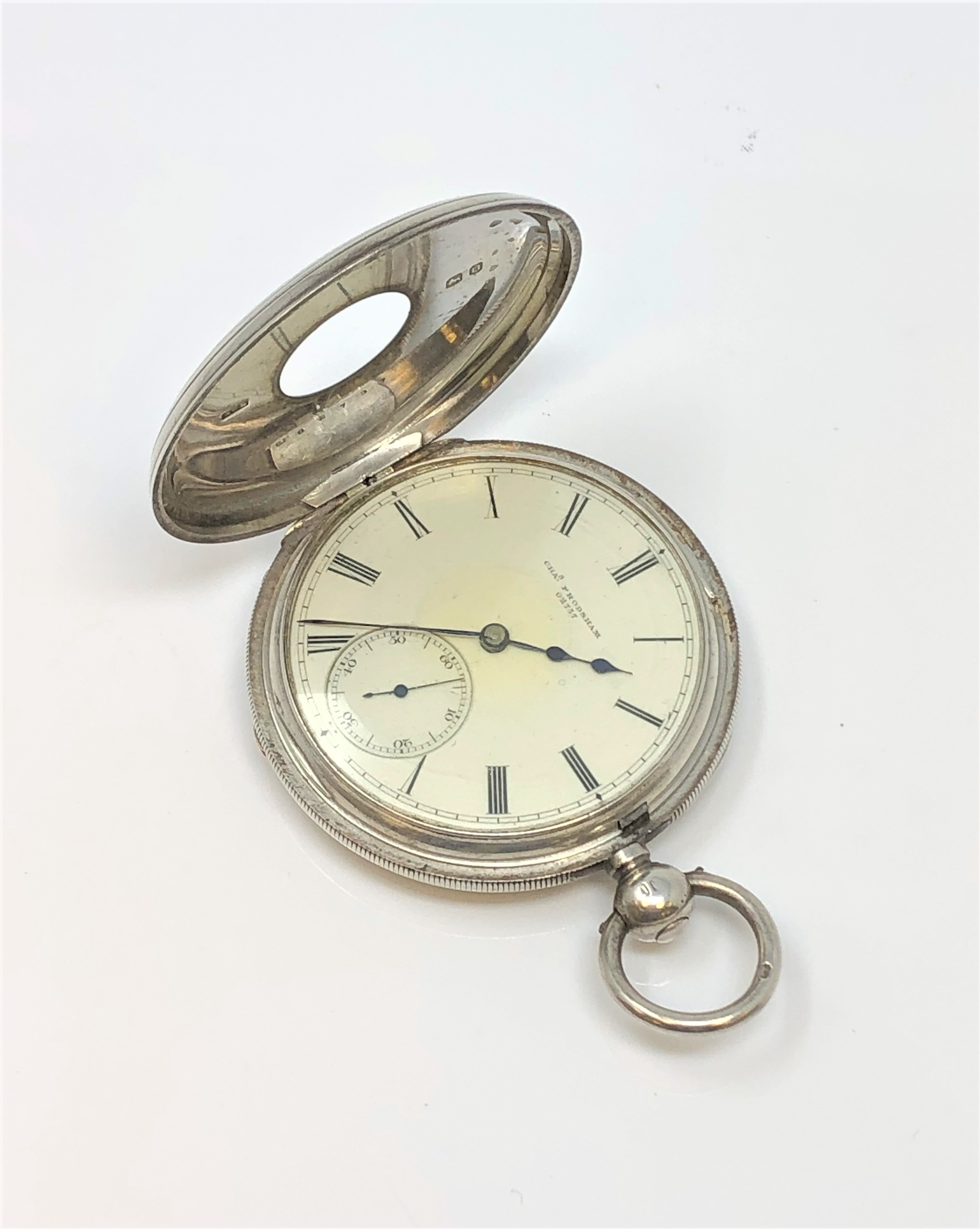 A good quality silver half hunter pocket watch by Charles Frodsham, 84 Strand, London, No. 02737.