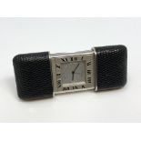A Purse/Travel Alarm Watch by Tiffany & Co, quartz battery movement, silvered dial signed,