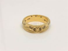An 18ct yellow gold and diamond ring by Boodles and Dunthorne, 7.2g, approximately 0.2ct, size O.