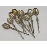 Ten ornate silver and silver gilt spoons,