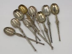 Ten ornate silver and silver gilt spoons,