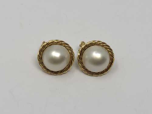 A pair of 18ct gold mabe pearl earrings.