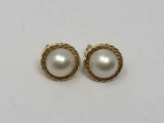 A pair of 18ct gold mabe pearl earrings.