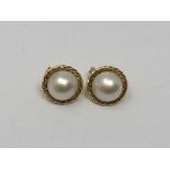 A pair of 18ct gold mabe pearl earrings.