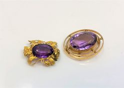 Two antique yellow metal brooches (lacking pins) mounted with amethysts, gross weight 8.8g.