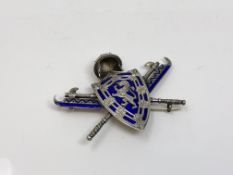 An unusual blue enamelled brooch,