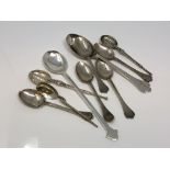 A collection of silver spoons, copies of 17th century designs.