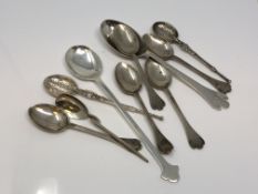 A collection of silver spoons, copies of 17th century designs.