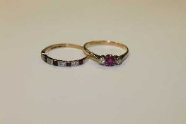 Two 18ct gold ruby and diamond rings, Both size T.