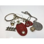 A collection of silver and white metal jewellery, coin on chain, ring etc.